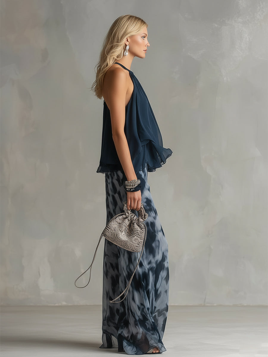 Luisa - Elegante chiffonjurk met een hooggesloten top en een wijde broek met patroon.