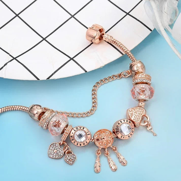 Rosé Traumfänger Armband mit silbernen Anhängern